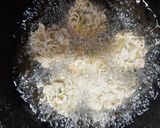A picture of step 5 of Maggi cheese bombs.