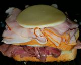 A picture of step 3 of Mike's Hot 3 Meat 2 Cheese French Dip Paninis.