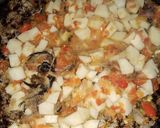 A picture of step 2 of Indomie with potato and dried fish.