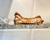Foto del paso 12 de la receta: Costillar asado, al vino tinto, con hierbas aromáticas