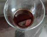 A picture of step 2 of Butterfly pea flower coffee latte.