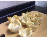 A picture of step 7 of Egg-cheese salad in bread cups.