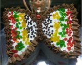 A picture of step 24 of Butterfly doll cake.