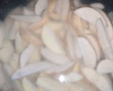A picture of step 2 of Spicy potato wedges.