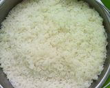 A picture of step 1 of Steamed Rice with Vegetables.