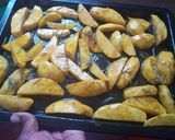A picture of step 4 of Rosemary baked potato wedges.