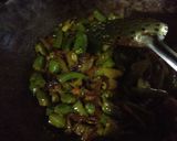 A picture of step 2 of Fried chilli with onion and raw mango.