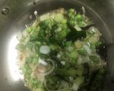 A picture of step 3 of Baingan bharta with green peas.