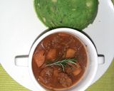 A picture of step 6 of Mokimo served with beef stew.