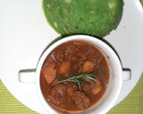 A picture of step 6 of Mokimo served with beef stew.