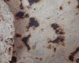 A picture of step 10 of Urad/maash ki khatti daal with bajrey ki roti.