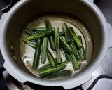 A picture of step 1 of Besan Drumstick curry.