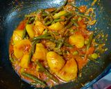 A picture of step 4 of French beans potatoes and peas curry in African style.