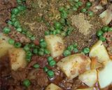 A picture of step 3 of Karahi qeema matar with brown onion rice.