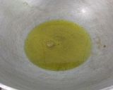 A picture of step 12 of Fried Dhoka.