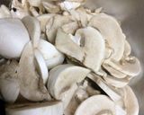 A picture of step 4 of Mushroom mattar curry with coconut flavour.
