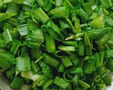 A picture of step 1 of Spring onion jhunka.