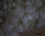 A picture of step 1 of Eggs with Tomato and Onion.