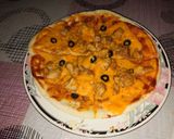 A picture of step 4 of Instant chicken Tikka Pizza in frying pan.