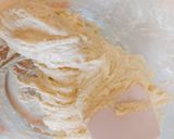 A picture of step 5 of Non-fried Old Fashioned Doughnuts.