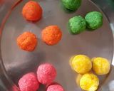 A picture of step 3 of Rabdi with colourful coconut ladoo.
