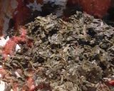 A picture of step 1 of Alu meethi (fenugreek leaves).
