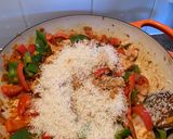 A picture of step 3 of Spanish style tomato and chicken baked rice.