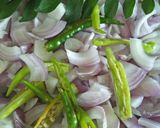 A picture of step 1 of Kaande Matar Pohe (Savory Flattened Rice With Green Peas).