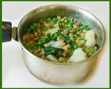 A picture of step 5 of A green koottu with Mung, green peas, and kale.