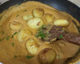 A picture of step 8 of Dum Aloo.