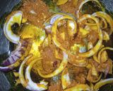 A picture of step 3 of Alkubus with onion sauce.