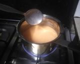 A picture of step 4 of Orange coloured Egg Pudding.