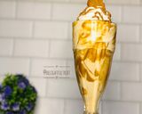 A picture of step 7 of Biscoff milkshake.