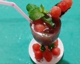 A picture of step 6 of Watermelon Mojito with blue Curacao.