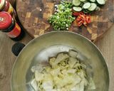 A picture of step 2 of Spicy cabbage, carrot and cucumber pickle.