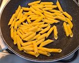 A picture of step 7 of Ocean Blue Pasta with Toasted Pine Nuts and Parmesan.
