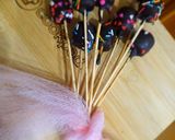 A picture of step 7 of 1 bite chocolatey marshmallow pops.