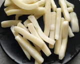 Foto del paso 3 de la receta: Patatas guisadas con rabas de calamar