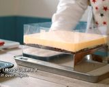 A picture of step 15 of Tiramisu, and Cocoa Sponge with plenty of Coffee Syrup.