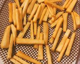 A picture of step 3 of Yam fries paired with peppered shrimp sauce.