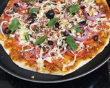 A picture of step 5 of Italian thin crust pizza.