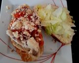 A picture of step 2 of My Tigerbread Sandwich fresh chicken, tomatoes sliced, + more 😘.