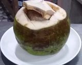 A picture of step 8 of Green Curry Squid in Young Coconut.