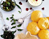 A picture of step 14 of Turiya patra with poori and basundi.