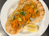 Chicken tikka on naan with fragrant salad