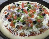 A picture of step 4 of Chicken Tikka pizza.