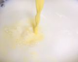 A picture of step 1 of Swiss roll mangoes custard loaded with walnuts.