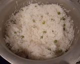 A picture of step 2 of White Rice with Green Peas🍚.