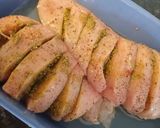 A picture of step 1 of Hasselback chicken with pesto, mozzarella and tomatoes.
