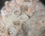 Foto del paso 7 de la receta: Sepia con gambas y calamares en salsa de ajo, perejil y coco…con base de arroz blanco